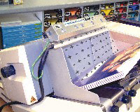 The Super Ion Air Knife eliminates jamming while improving print quality on an ink jet addressing machine.