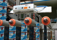 The Super Ion Air Knife eliminates the static charge on labels being applied to PET soft drink bottles.