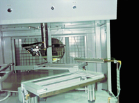 A Model 7212 Standard Ion Air Knife System cleans metal frames prior to powder coating.